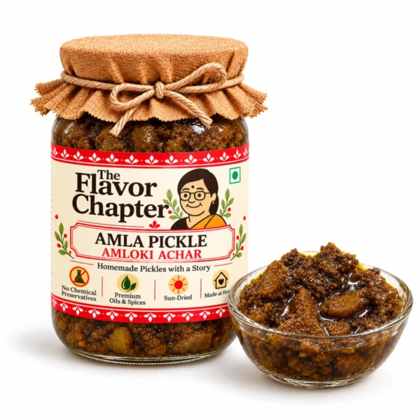 Amla pickle amloki achar jar with a glass bowl of dark jaggery cooked amla segments in mustard oil