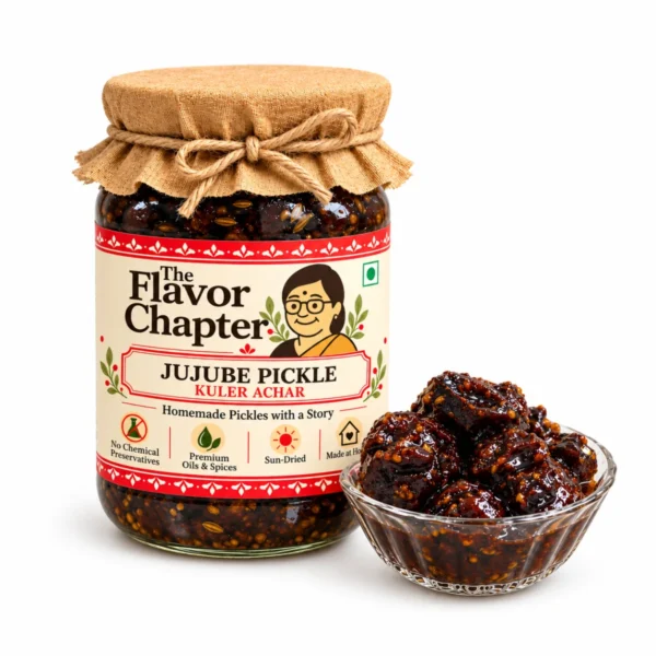 Homemade kuler achar (jujube pickle) in a The Flavor Chapter jar with a bowl of dark sweet and tangy kul in syrup, on white