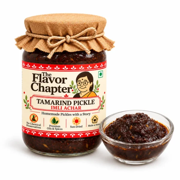 Tamarind pickle imli achar jar with a small glass bowl of the dark tamarind jaggery paste